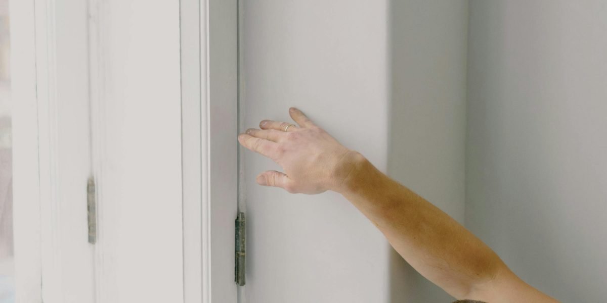 A person thoroughly inspecting an apartment during a viewing, highlighting the importance of due diligence.