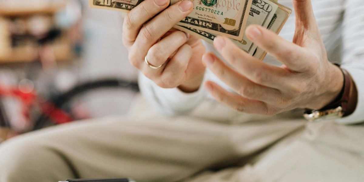 An individual thoughtfully considering their financial future with an advisor.
