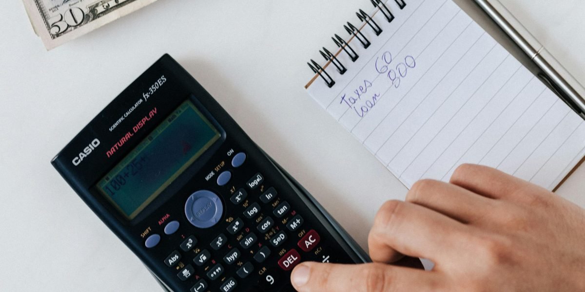Prospective tenant carefully reviews figures, highlighting the often-overlooked additional costs of renting in Dubai.
