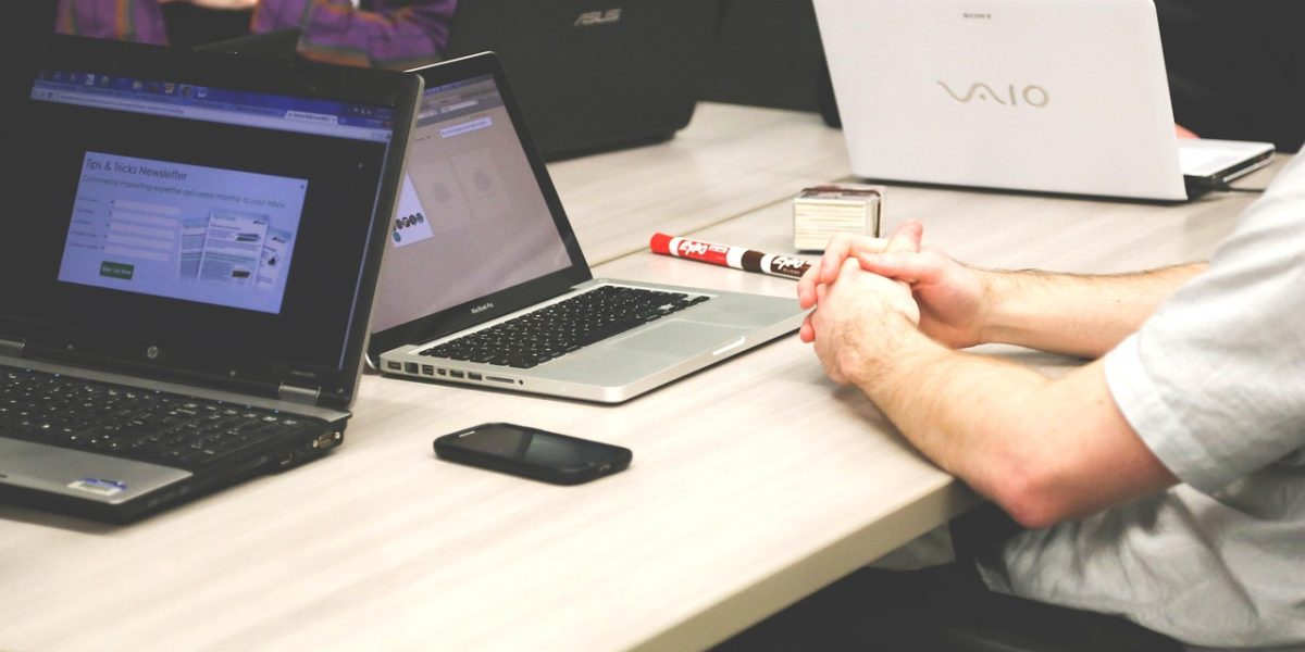 An advisor and client engaged in a meeting, conveying an atmosphere of trust and open communication crucial for financial planning.