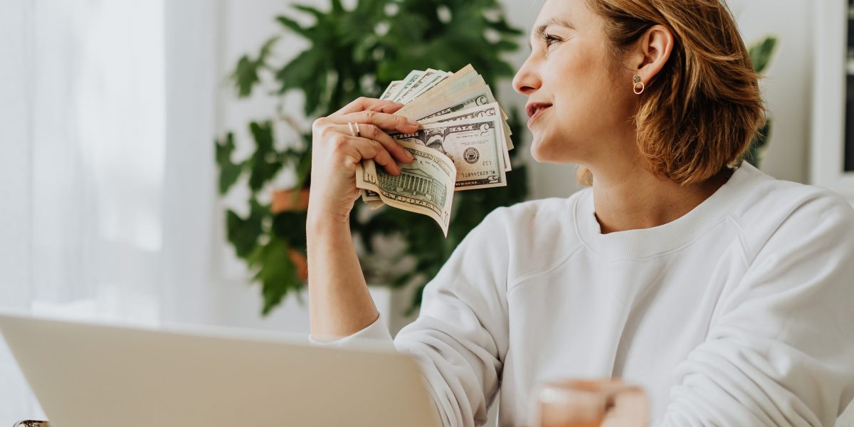 A person celebrating a successful investment outcome, representing maximized returns and financial growth.