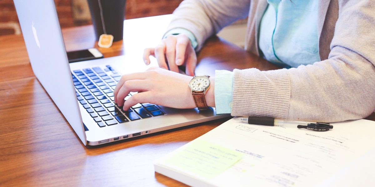 A person diligently researches and evaluates options to select a trustworthy financial advisor.