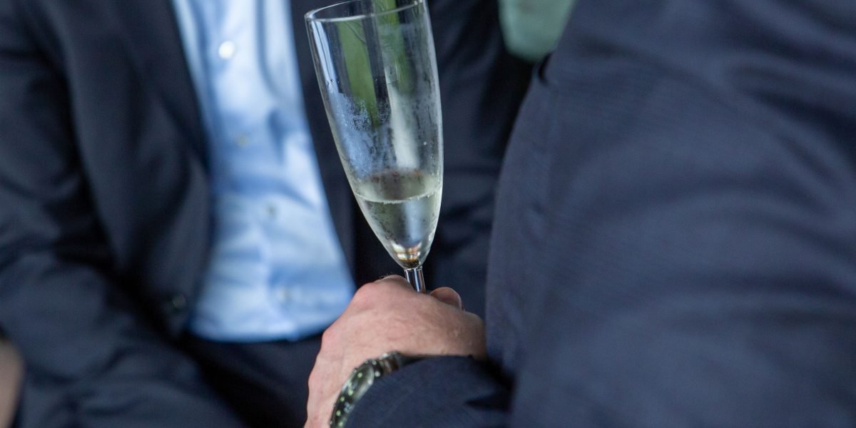 Professionals engaging in conversation at a business networking event, fostering connections.