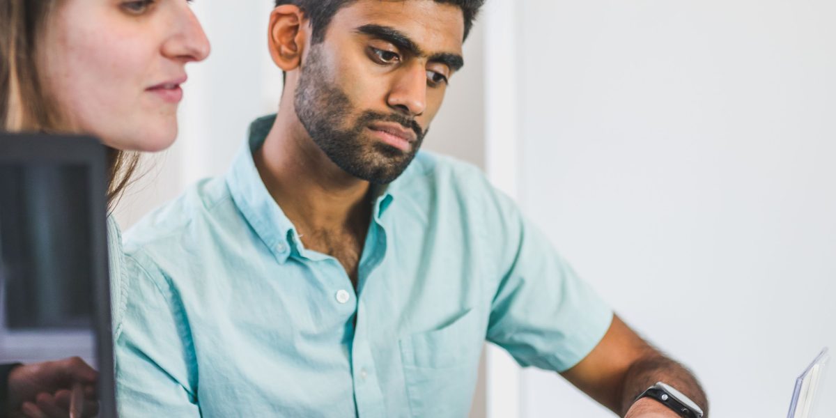 A financial advisor guides a client through the documentation and processes for securing investor residency in Dubai.